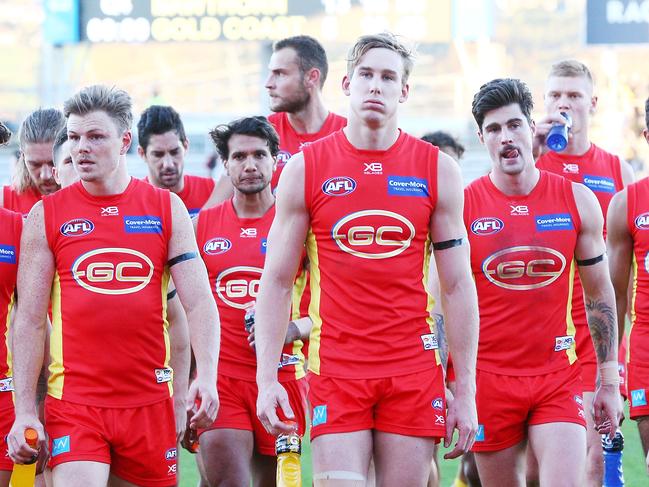 LAUNCESTON, AUSTRALIA - JUNE 23:  Tom Lynch of the Suns (C) looks dejected after defeat during the round 14 AFL match between the Hawthorn Hawks and the Gold Coast Suns at University of Tasmania Stadium on June 23, 2018 in Launceston, Australia.  (Photo by Michael Dodge/Getty Images)