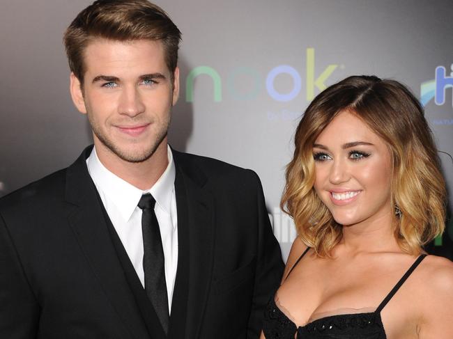 Hemsworth and Cyrus at the premiere of The Hunger Games in LA in March 2012. They were engaged two months later. Picture: Getty