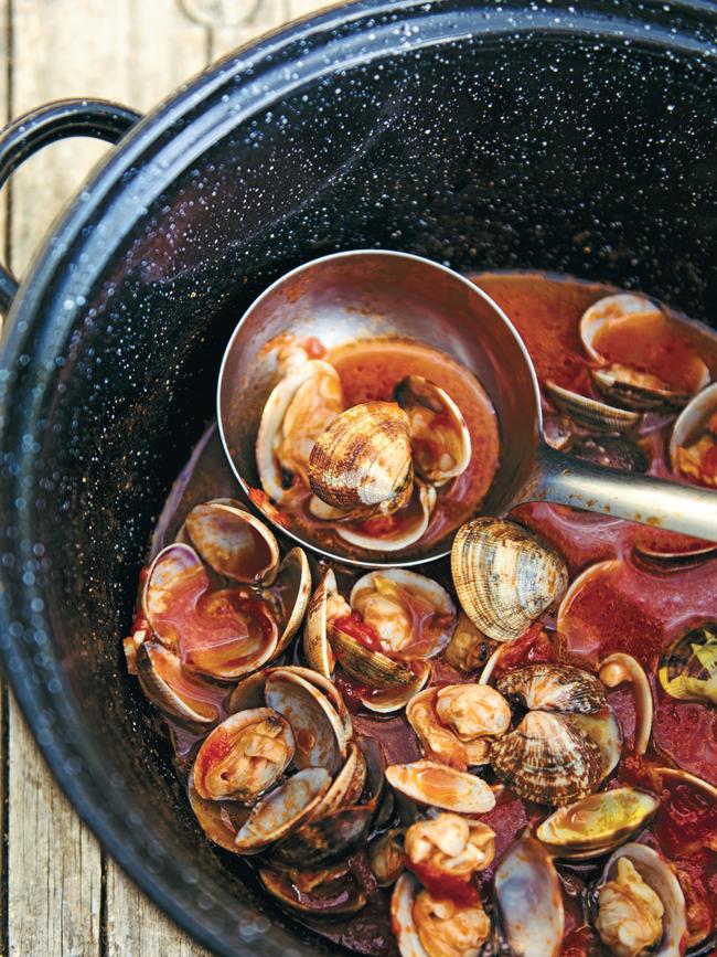 Let the clams cook for 1-2 minutes, then cover and let the steam open up the shells. Picture: Emiko Davies.