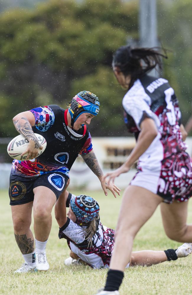 Kirra Muggeridge of ATSiCHS – Sister Girls against Bradley Dahlstrom Memorial in the Warriors Reconciliation Carnival women's games hosted by Toowoomba Warriors at Jack Martin Centre, Saturday, January 18, 2025. Picture: Kevin Farmer