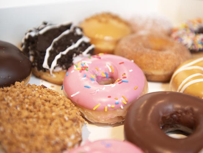 Fresh Student Media are having a Krispy Kreme day to help raise funding for new equipment. L-R Summer Thorsen-Lindley, Charlie Norns and Renae Adamson with Krispy Kremes. September 12th 2018. Picture: Ellen Smith