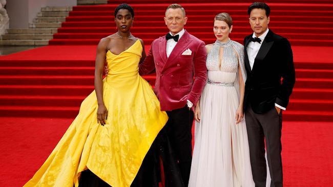 English actor Lashana Lynch (left), English actor Daniel Craig and French actor Lea Seydoux and US film director Cary Joji Fukunaga pose on the red carpet at the world premiere of No Time To Die. Picture: Tolga Akmen/AFP