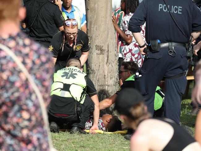 A festival goer is treated by medics at the FOMO festival in Parramatta Park last year. Picture: David Swift.