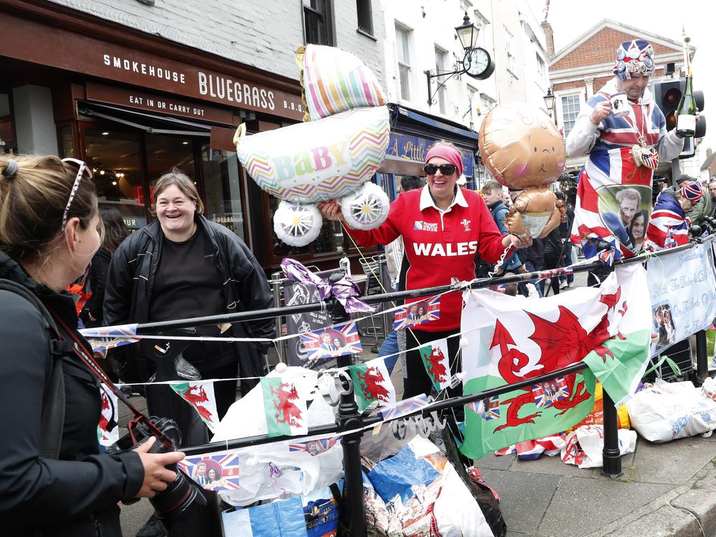 Excited wellwishers lined the streets of Windsor after it was announced that Meghan and Harry had welcomed a boy. Picture: AP Photo/Alastair Grant