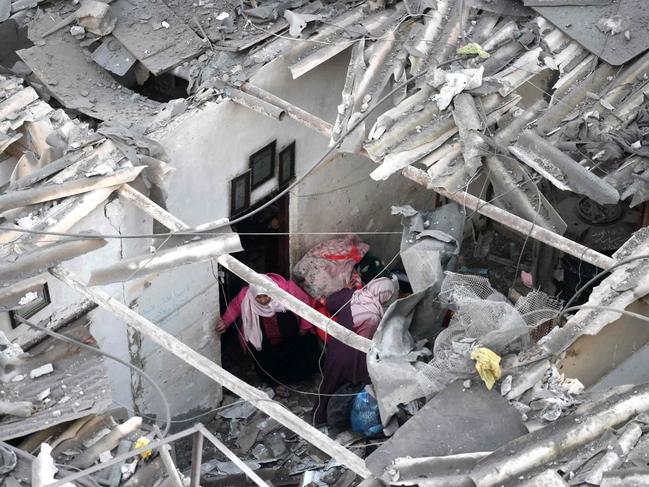 Palestinians check the destruction following Israeli bombardment in Rafah, in the southern Gaza Strip. Picture: AFP