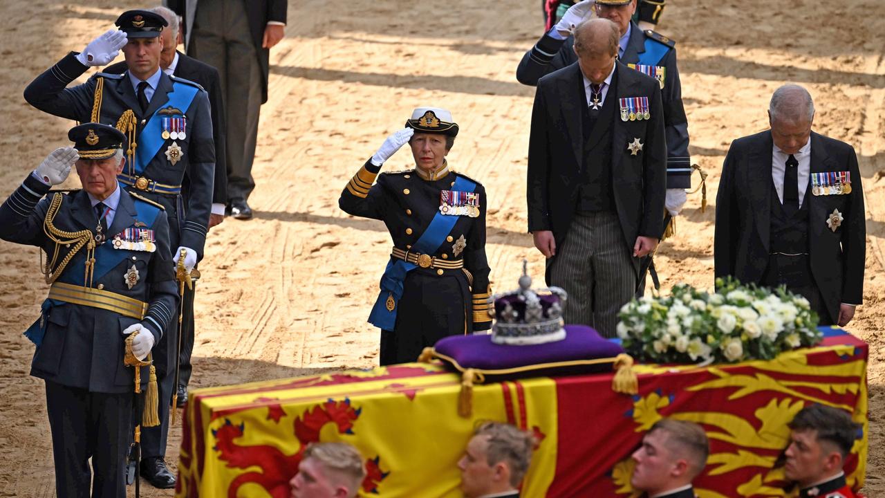 Prince Harry and Prince Andrew stare at the floor as King Charles III, Prince William and Princess Anne give the royal salute for the Queen. Picture: Getty Images.