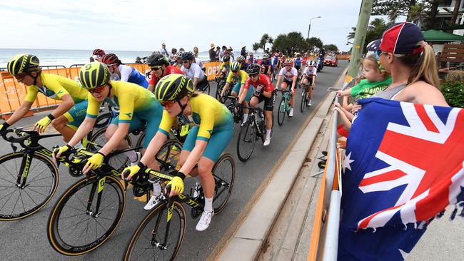 The peloton is seen during the women's cycling road race along Currumbin beach on day ten of the XXI Commonwealth Games on the Gold Coast, Australia, Saturday, April 14, 2018. (AAP Image/Dan Peled)