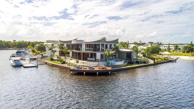 A luxury six-bedroom waterfront home at Pelican Waters has been sold to a Sydney buyer, smashing the $3 million barrier to set a new suburb record.