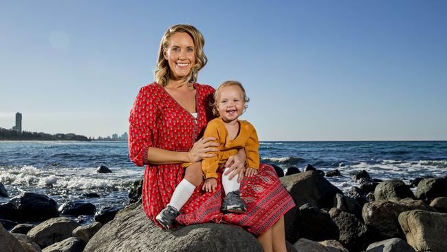 Jess Skarratt with daughter Hallie at 16 months at Burleigh beach. Picture: Jerad Williams