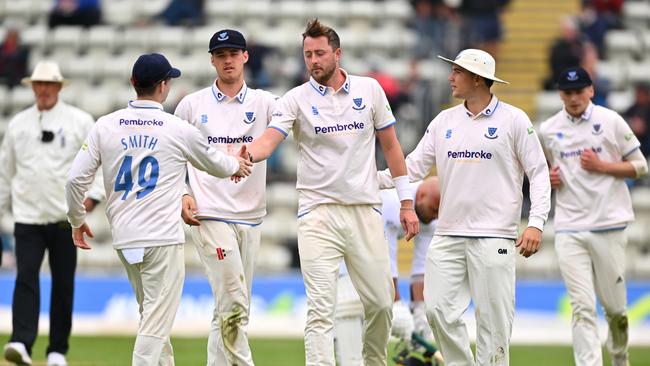 Ollie Robinson of Sussex celebrates with Steve Smith after taking the wicket of Matthew Waite of Worcestershire. (Photo by Dan Mullan/Getty Images)