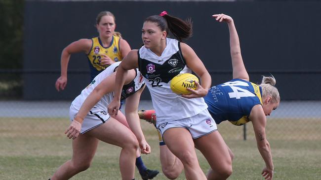 The preliminary final of the QAFLW (female Aussie rules) clash between Bond University Bull Sharks (blue and yellow) and Southport Sharks (black and White). Bond uni Player No 44Teagan Tatlock Southport Player No 22 Poppy Boltz Picture Mike Batterham