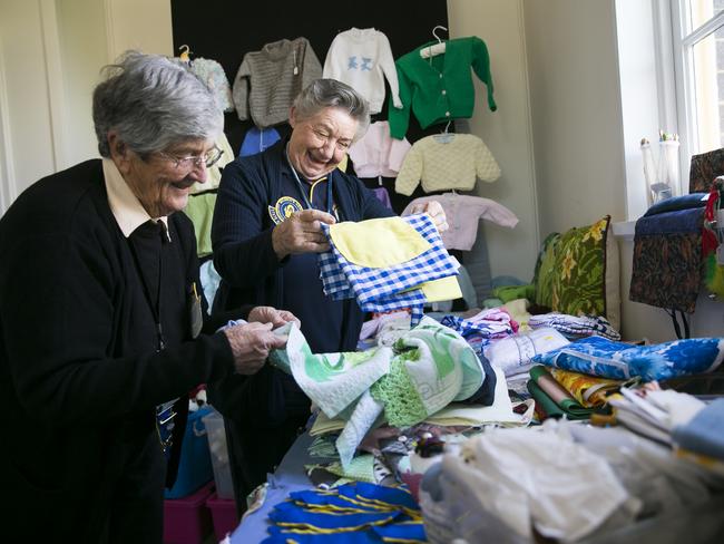 Anne Pratt and Alisa Stewart sort through handicrafts. Picture: Dylan Robinson