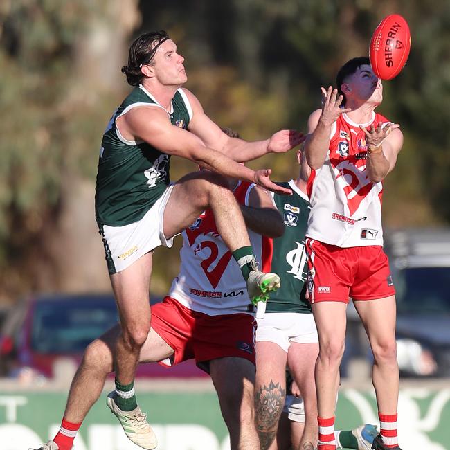 Shepparton Swans’ Enrique Goggin marks in front of Echuca’s Will Monahan.