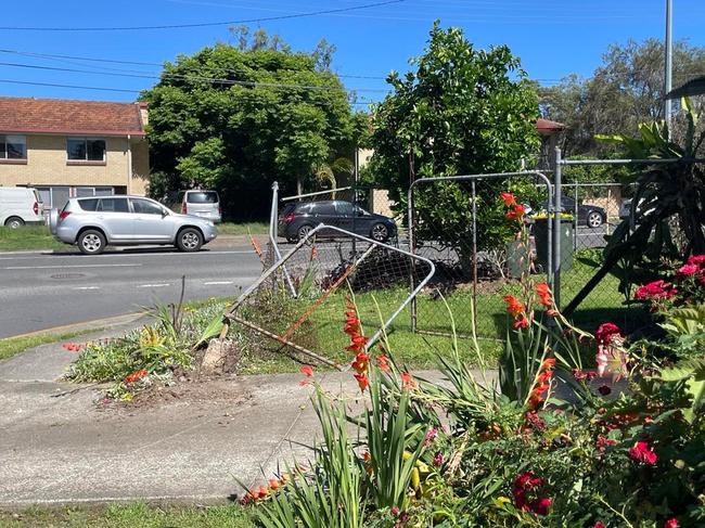 A neighbour's fence was damaged on Monday when men linked to the home invasion crashed a car and threw a gun into bushes.