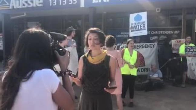 Protesters gather outside George Christensen's office