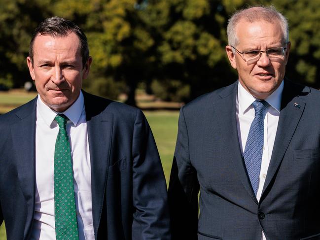 WA Premier Mark McGowan (left) and Prime Minister Scott Morrison are seen arriving for a press conference in Perth, Thursday, March 17, 2022.  (AAP Image/Richard Wainwright) NO ARCHIVING