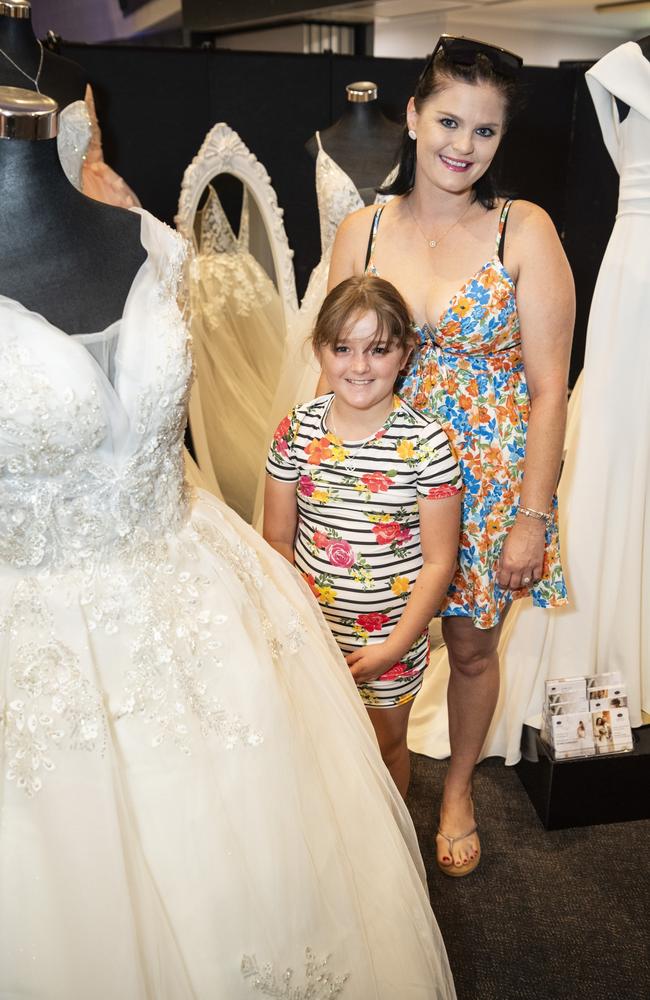 Aviana Horrex and mum Tiffany Dibben check out the A Touch of Romance gown display Toowoomba's Wedding Expo hosted by Highfields Cultural Centre, Sunday, January 21, 2024. Picture: Kevin Farmer