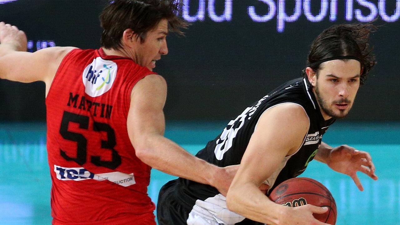 Damian Martin of the Wildcats fouls Chris Goulding of United during the NBL Match Melbourne United versus the Perth Wildcats at Hisense arena in Melbourne on Sunday 27th December, 2015. Picture: Mark Dadswell
