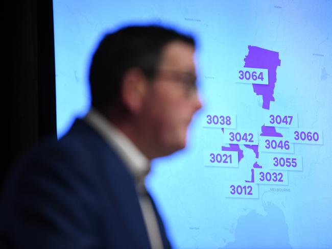 Postcodes of Melbourne suburbs to be locked down are seen on a television screen as Victorian Premier Daniel Andrews speaks to media yesterday. Picture: AAP