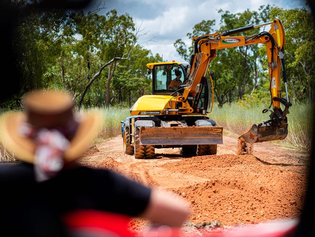 Darwin River resident Necia Sutton said Pipeline Rd had become inaccessible due to heavy downpours this wet season. Machinery came to temporarily fix the road after the <i>NT News</i> made inquiries. Photograph: Che Chorley