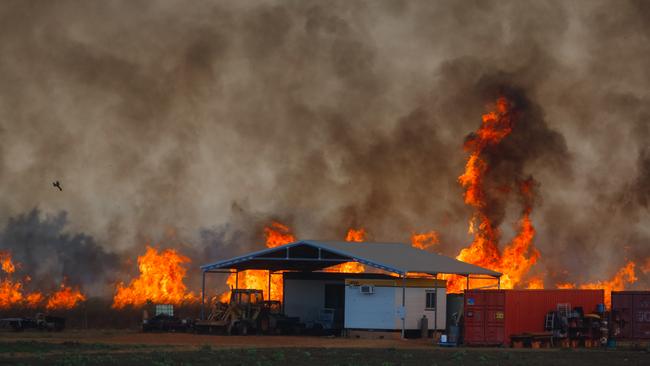 The fire front threatens farm infrastructure as dangerous fire conditions continue through the Litchfield/Batchelor Area Picture GLENN CAMPBELL