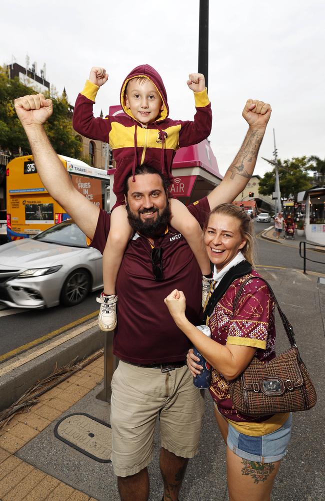 Josh Amey, Winston Amey, 5, and Abbie Seitz pictured at the Broncos v Rabbitohs, round 1, on Caxton Street, Brisbane 11th of March 2022. This is the first game for the BroncosÃ&#149; season.