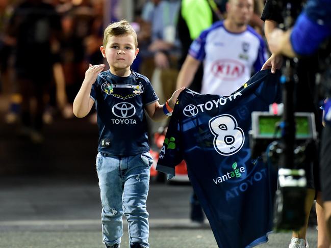 Matt Scott's wife Lauren and sons Hugo and Will lead his jersey out. NRL; North Queensland Cowboys Vs Canterbury-Bankstown Bulldogs at 1300 Smiles Stadium. Picture: Alix Sweeney