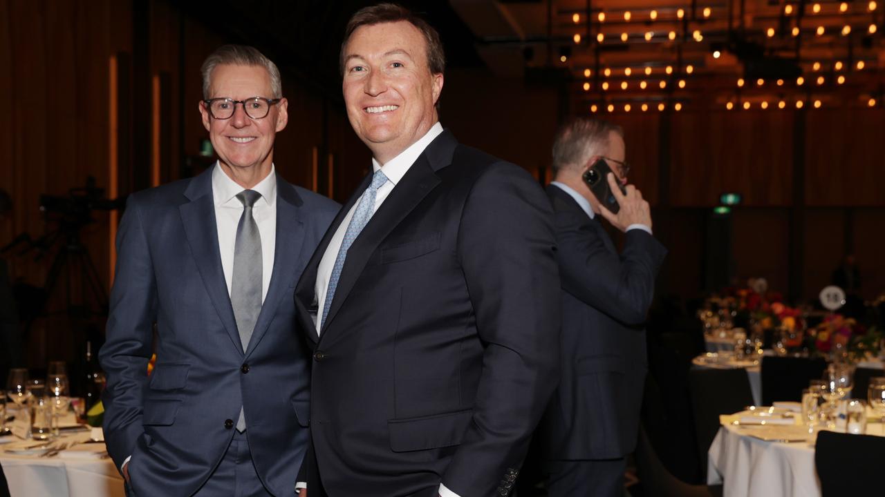 BCA president Geoff Culbert and chief executive Bran Black enjoy the festivities as Anthony Albanese takes a call. Picture: Jane Dempster