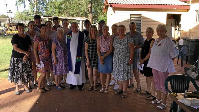 Fr Jamie Collins with attendees of the Mungalalla Christmas mass. Picture: David Bowden