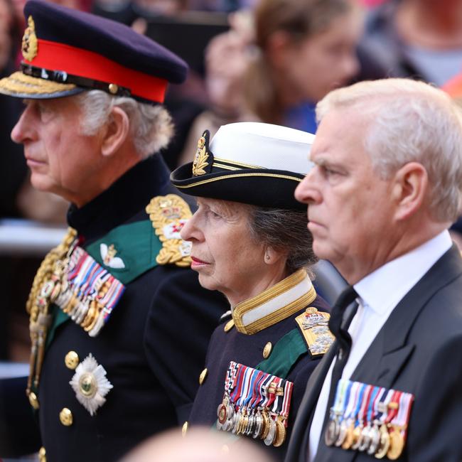 King Charles III, Princess Anne, Princess Royal and Prince Andrew, Duke of York walk behind Queen Elizabeth II's Coffin as it heads to St Giles Cathedral.