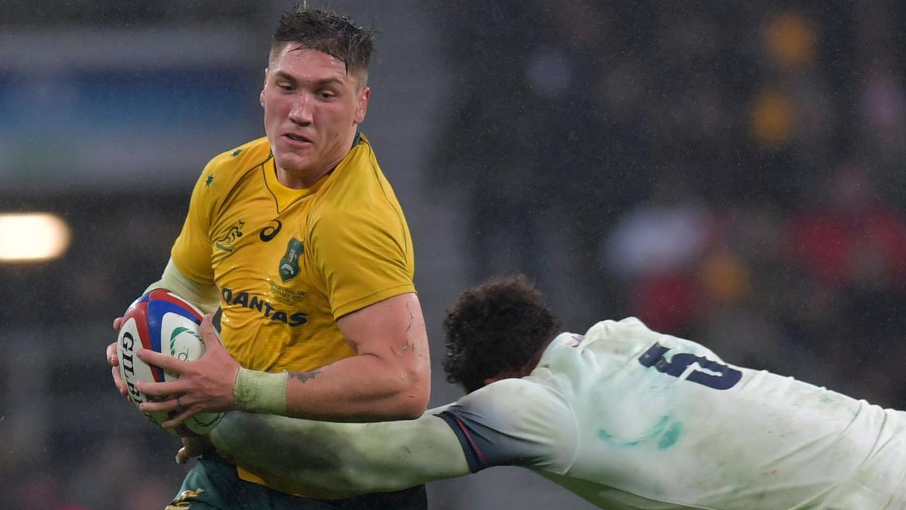 Australia’s Sean McMahon is tackled by England lock Courtney Lawes.