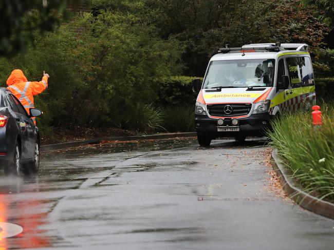 An ambulance leaving Anglicare's Newmarch House nursing home at Caddens in western Sydney. Picture: Richard Dobson