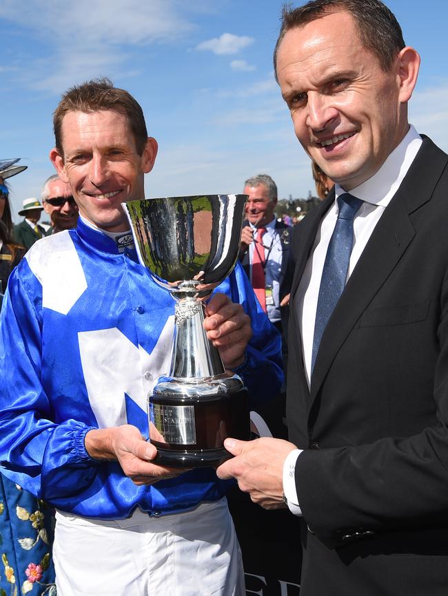 Job done: Winning trainer Chris Waller and Hugh Bowman with Turnbull Stakes trophy. Picture: Getty Images