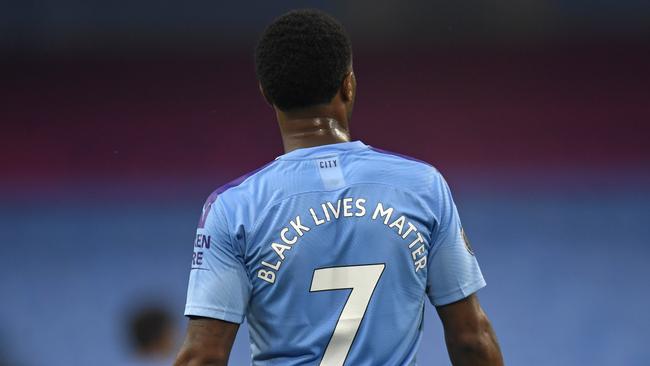 Manchester City's Raheem Sterling stands on the pitch during the English Premier Leaguematch against Arsenal at the Etihad Stadium on Wednesday, June 17. The English Premier League resumes Wednesday after its three-month suspension because of the coronavirus outbreak. (Peter Powell/Pool via AP)