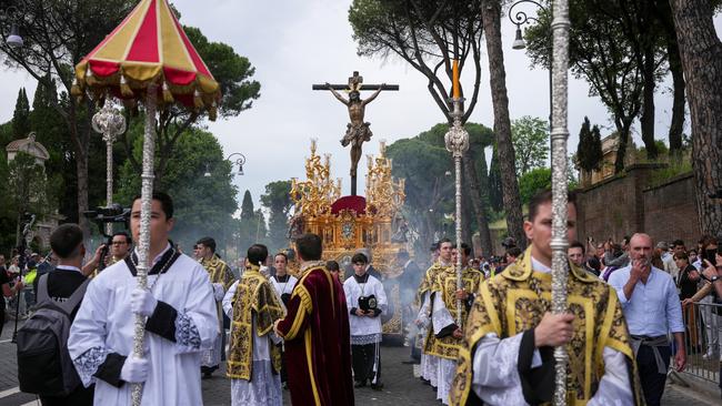 Confraternity members march in a procession through old Rome during the Jubilee on Saturday. Picture: Christopher Furlong/Getty Images