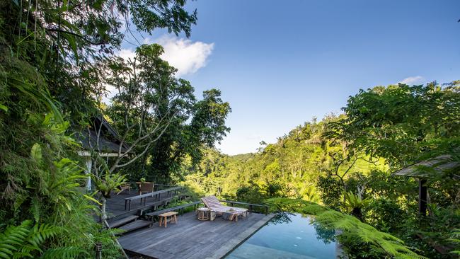 The private pool with villas at Buahan, a Banyan Tree resort.