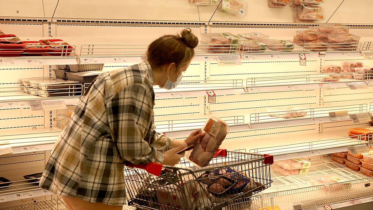 A shopper looks at the near empty chicken section at Coles Supermarket Bondi Junction. Picture: Jane Dempster/The Australian.