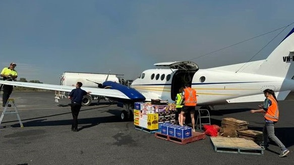 About 1200 kg of cargo, consisting of fruit, vegetables and other grocery items were being unloaded in Kowanyama earlier this year. Picture: Shaun Quigley.