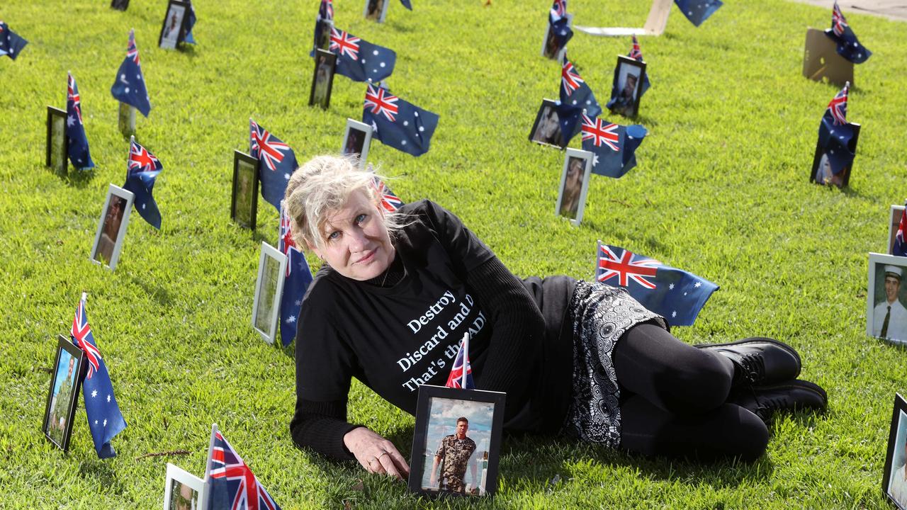 Julie-Ann Finney is displaying photos at Geelong waterfront of Veterans who have died by suicide, one of which is her son David. Picture: Alison Wynd