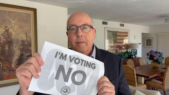 Peter Ryan, The ABC’s senior business corresponded, holding up a “I’m voting no” placard.