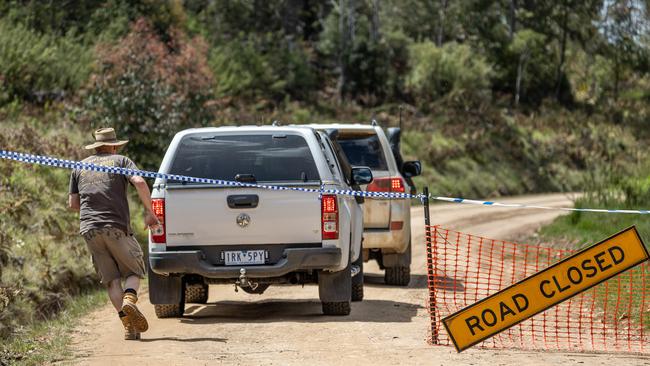 Police enter the closed off area. Picture: Jason Edwards