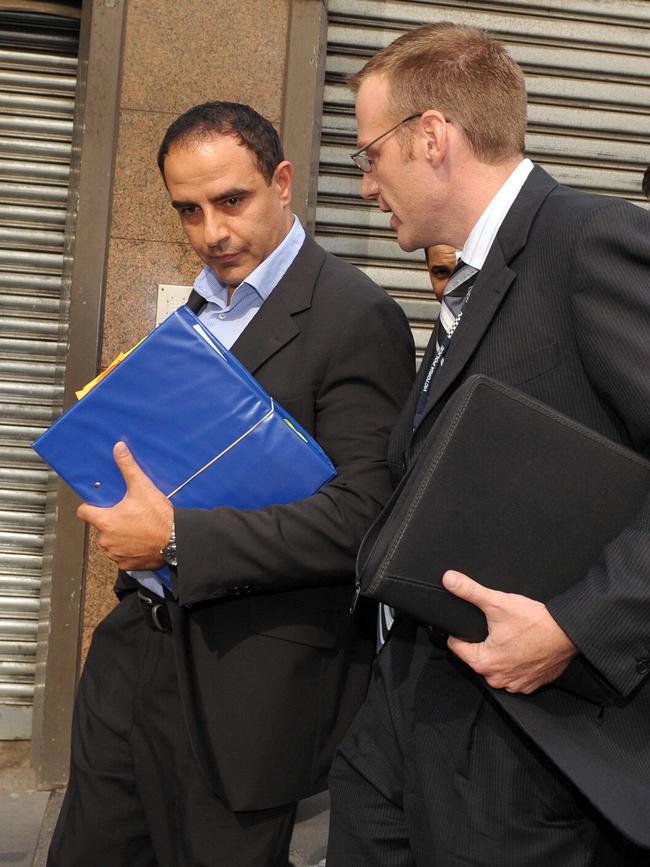  Purana task force detectives swoop on Karam outside the Melbourne Magistrates Court.