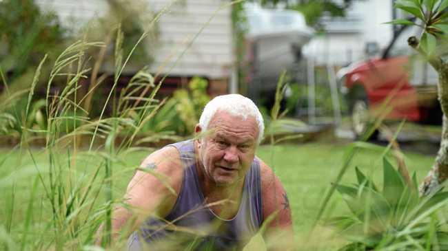 Michael Iveli said he was frustrated after trying to get Council to removed 6ft overgrown grass at the front of his home. Picture: Marc Stapelberg