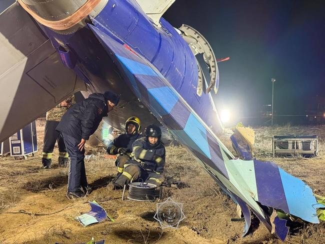 Emergency specialists work at the crash site of an Azerbaijan Airlines passenger jet near the western Kazakh city of Aktau. Picture: AFP