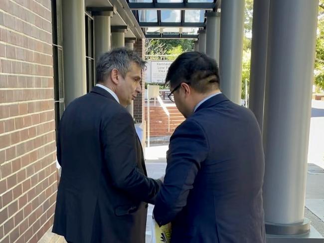 Slobodan Jankovic (left) outside Burwood Local Court with his lawyer (right).