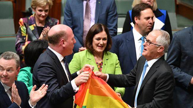 Liberal Member for North Sydney Trent Zimmerman and Prime Minister Malcolm Turnbull celebrate the passing of the Marriage Amendment Bill.