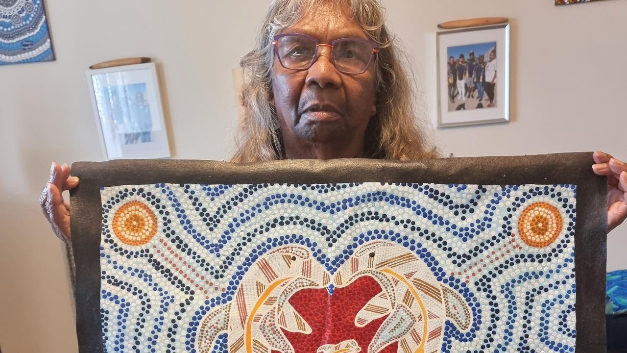 Kevin Bugmy’s sister, Doreen Webster, holds an artwork that her dead brother kept in his cell. Picture supplied by the Aboriginal Legal Service via NCA NewsWire.