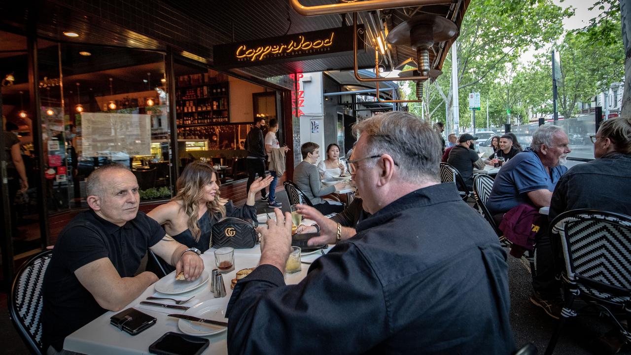 Diners on Melbourne’s Lygon Street today, as the city emerges from a months-long lockdown. Picture: Darrian Traynor/Getty Images