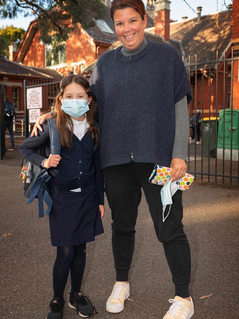 Paula Barbosa with her daughter, Elise, who is happy to wear a mask.