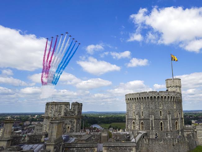 The Red Arrows fly over Windsor Castle in Berkshire during the ceremony to mark the official birthday of Queen Elizabeth II. Picture: WPA Pool/Getty Images